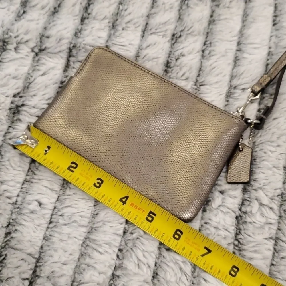 Cute metallic Coach bow wristlet